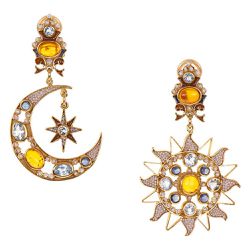 Since 1968, Percossi Papi has been designing his over-the-top, romantic jewels in a small Rome atelier. The contrasting shapes of these amber, sapphire, and topaz beauties look as great worn together as they do worn separately.