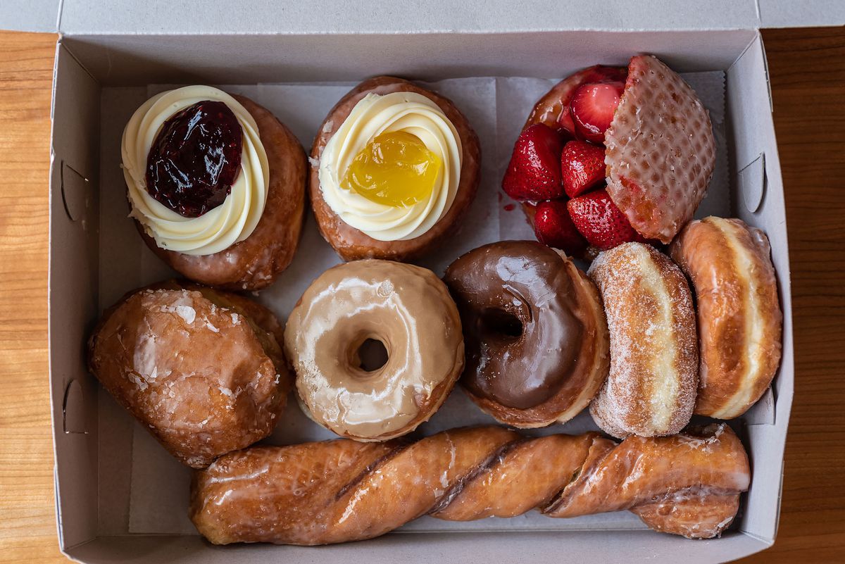 A white box of doughnuts shown from the top down from the Donut Man in Los Angeles, California.