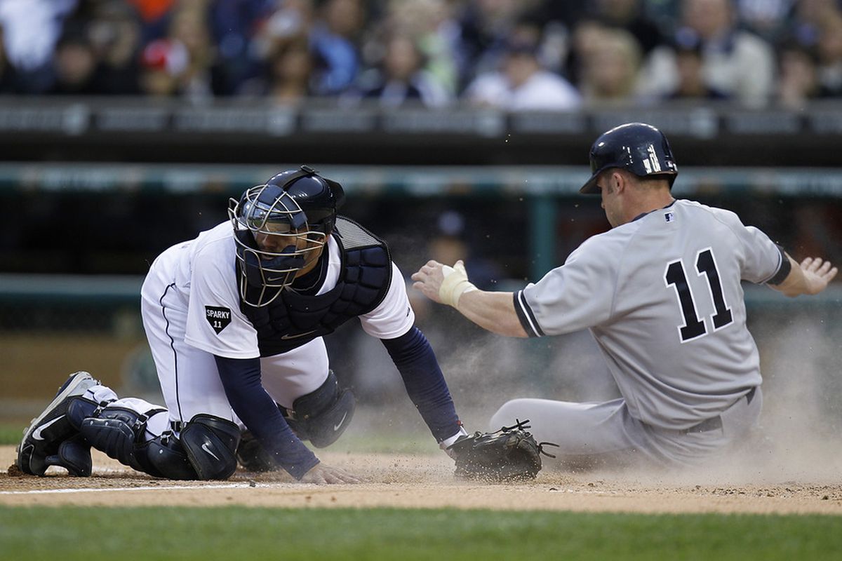 DETROIT, MI - MAY 02:  Brett Gardner #11 of the New York Yankees scores a run past Alex Avila #13 of the Detroit Tigers during the second inning at Comerica Park on May 2, 2011 in Detroit, Michigan.  (Photo by Gregory Shamus/Getty Images)