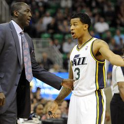 Utah Jazz head coach Tyrone Corbin and Utah Jazz point guard Trey Burke (3) talk during a short break between action during a game against the Chicago Bulls at EnergySolutions Arena on Monday, Nov. 25, 2013.