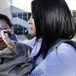 Cristina Gomez comforts her mother, Yadira Ibarra, as they reunite at Mountain View High School in Orem on Tuesday, Nov. 15, 2016, after five students were stabbed in an apparent attack by a 16-year-old boy.
