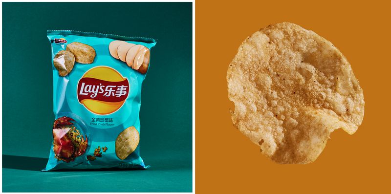 A bag of Lay’s Fried Crab Flavor next to a chip.