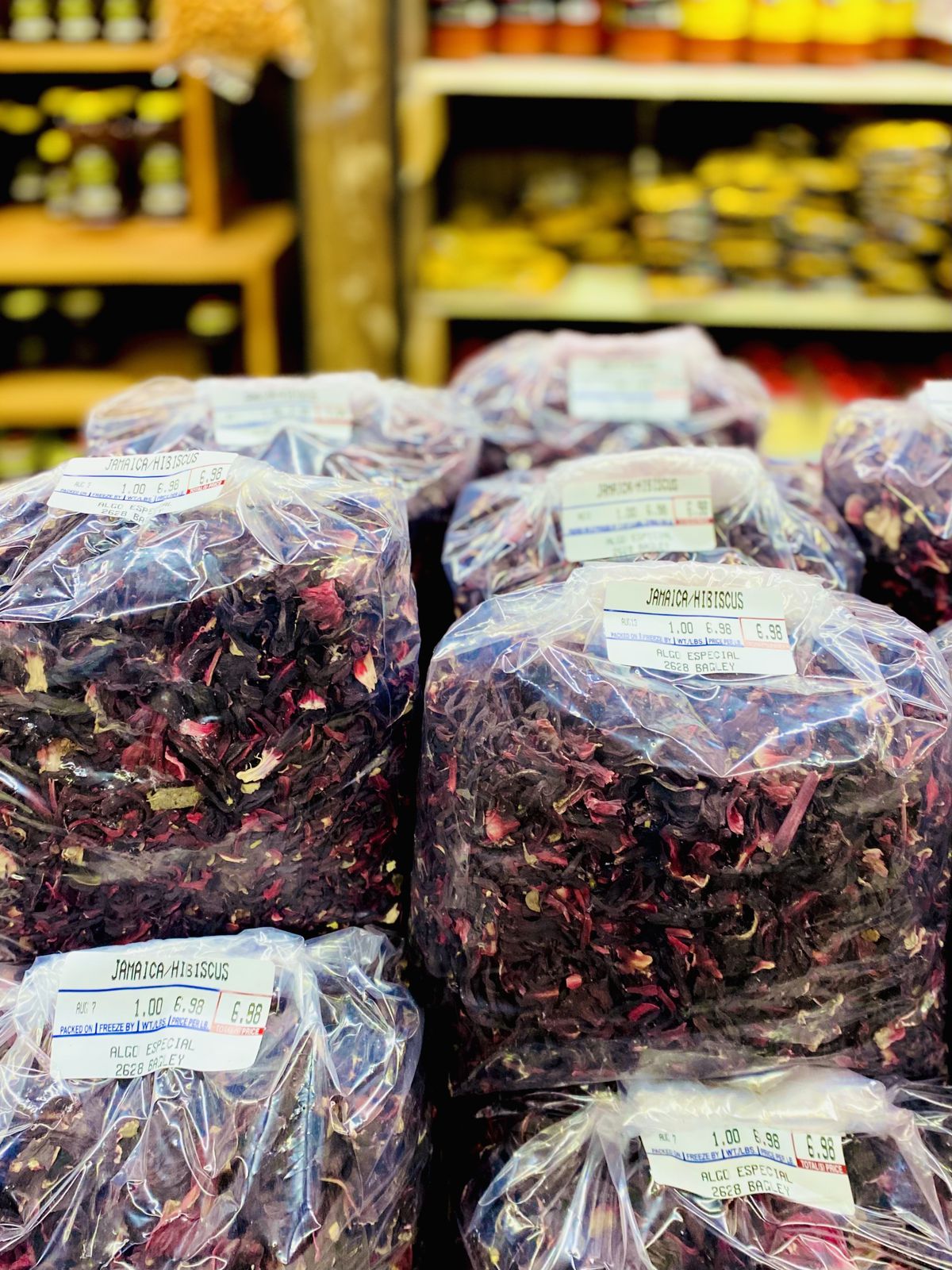 Bags of dried hibiscus flowers and shelves of other grocery items in the background from Algo Especial Supermercado at 2628 Bagley St. in Detroit, Michigan.