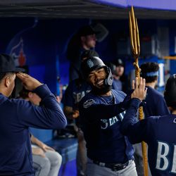 Teoscar Hernandez #35 of the Seattle Mariners celebrates a solo home-run in the dugout during the sixth inning of their MLB game against the Toronto Blue Jays at Rogers Centre on April 30, 2023 in Toronto, Canada.