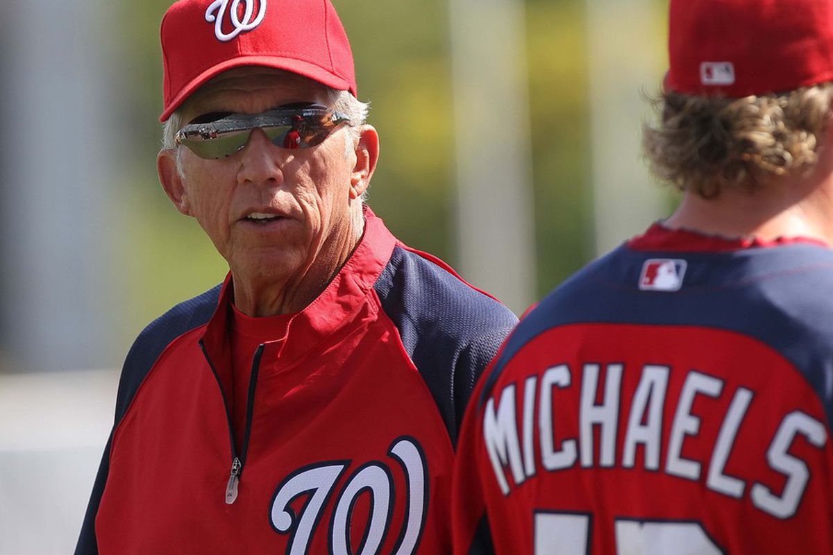 March 16, 2012; Tampa, FL, USA; Washington Nationals manager Davey Johnson (left) talks with left fielder Jason Michaels (12) prior to the game against the New York Yankees at George M. Steinbrenner Field. Mandatory Credit: Kim Klement-US PRESSWIRE