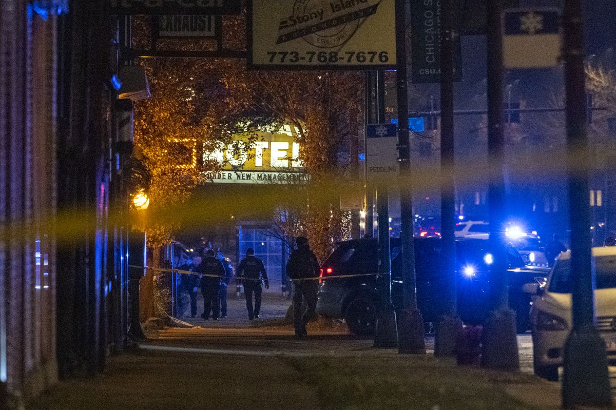 Chicago police officers work the scene where an officer was shot in the 9200 block of South Stony Island Ave, in the Calumet Heights neighborhood, Wednesday, Dec. 1, 2021.