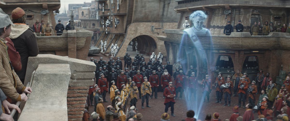 Maarva (Fiona Shaw) speaking as a hologram around a Ferrix crowd in Andor.