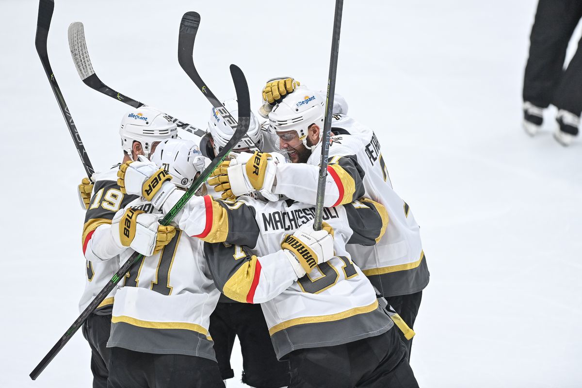 Vegas Golden Knights center Jonathan Marchessault (81), right wing Reilly Smith (19) and defenseman Alec Martinez (23) celebrate with center William Karlsson (71) after a third period Marchessault goal during a Stanley Cup Playoffs second round game between the Vegas Golden Knights and the Colorado Avalanche at Ball Arena in Denver, Colorado on June 8, 2021.
