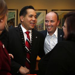 Utah Attorney General Sean Reyes, left, talks with Lt. Gov. Spencer Cox on election night in Salt Lake City, Tuesday, Nov. 4, 2014.
