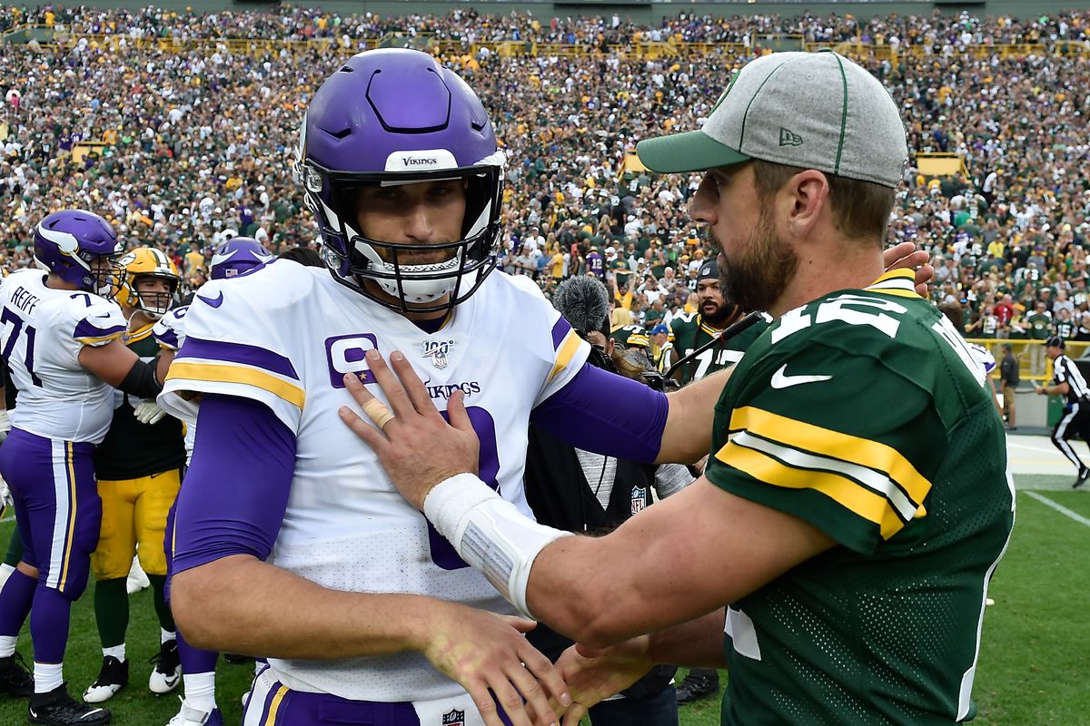 Kirk Cousins #8 of the Minnesota Vikings and Aaron Rodgers #12 of the Green Bay Packers after the game at Lambeau Field on September 15, 2019 in Green Bay, Wisconsin.