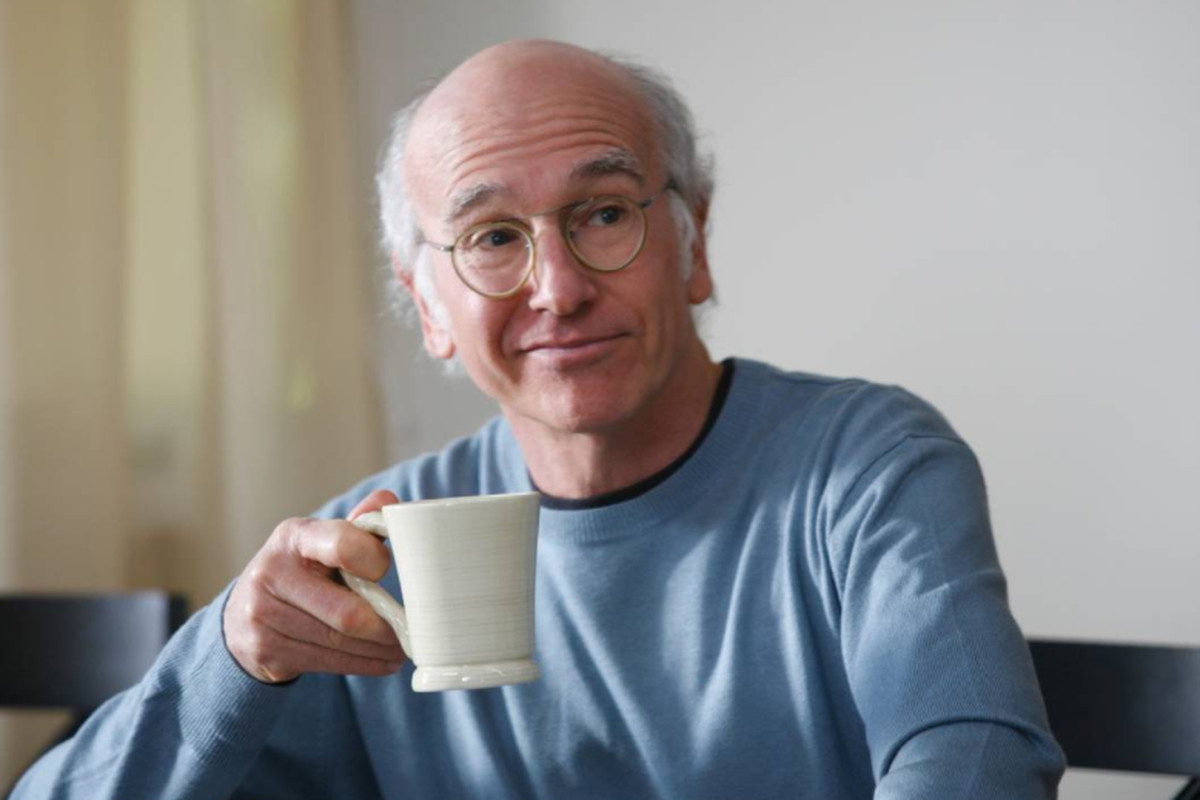 Larry David holds a coffee cub in a scene from Curb Your Enthusiasm.