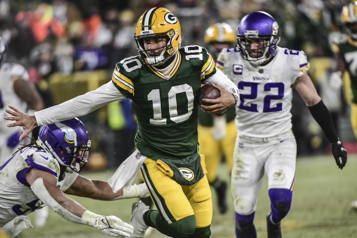 Green Bay Packers quarterback Jordan Love (10) scrambles for a first down in the fourth quarter against the Minnesota Vikings at Lambeau Field.
