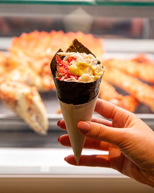 Hand holding seafood lobster cone