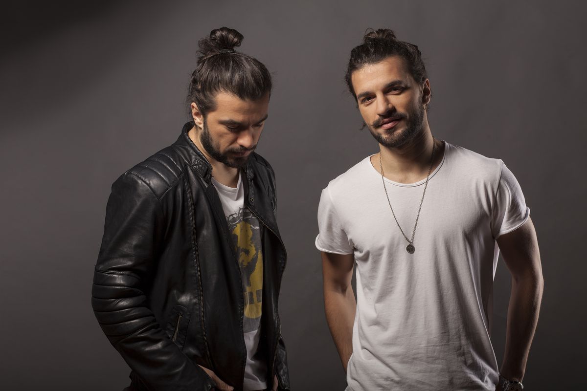 Two man buns, posing for you