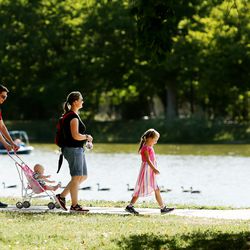 A family enjoys the afternoon at Liberty Park in Salt Lake City on Sunday, Sept. 1, 2019.