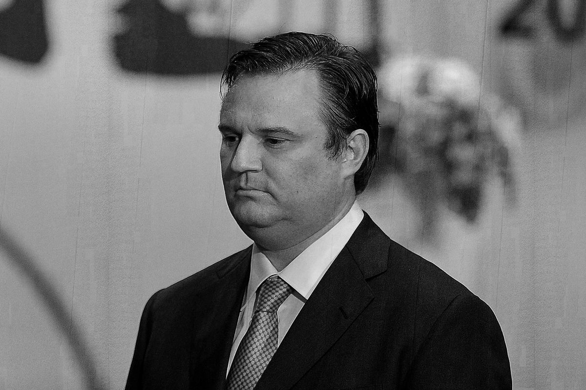 A black-and-white image of Daryl Morey staring pensively in the distance.
