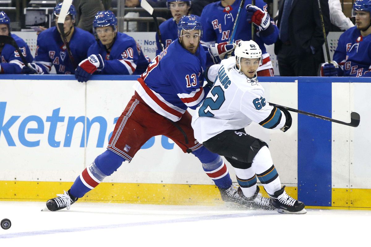 Oct 11, 2018; New York, NY, USA; New York Rangers center Kevin Hayes (13) defends against San Jose Sharks right wing Kevin Labanc (62) during second period at Madison Square Garden.
