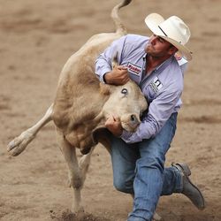 Jace Melvin wins the steer wrestling during the Days of '47 Rodeo in Salt Lake City on Thursday, July 20, 2017.