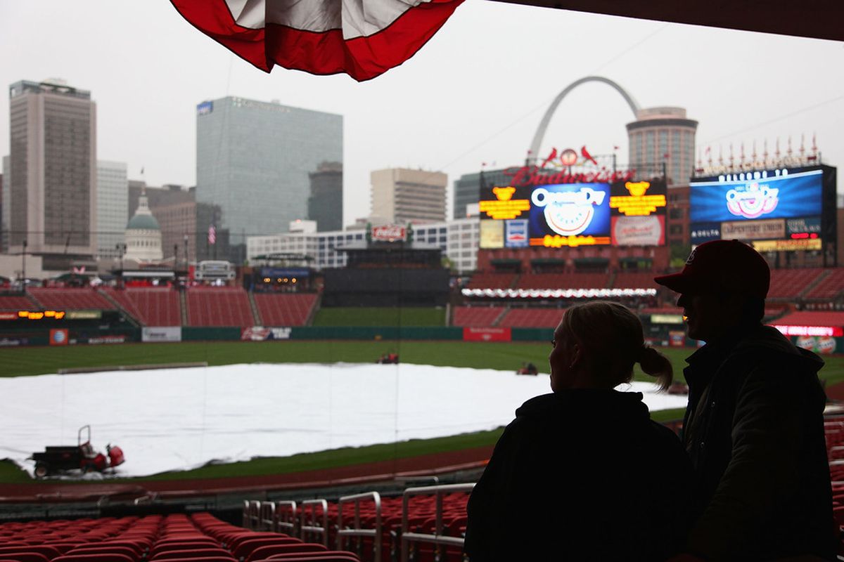 ST. LOUIS, MO - APRIL 13: Fans wait out a rain delay prior to the home opening game between the St. Louis Cardinals and the Chicago Cubs at Busch Stadium on April 13, 2012 in St. Louis, Missouri.  (Photo by Dilip Vishwanat/Getty Images)