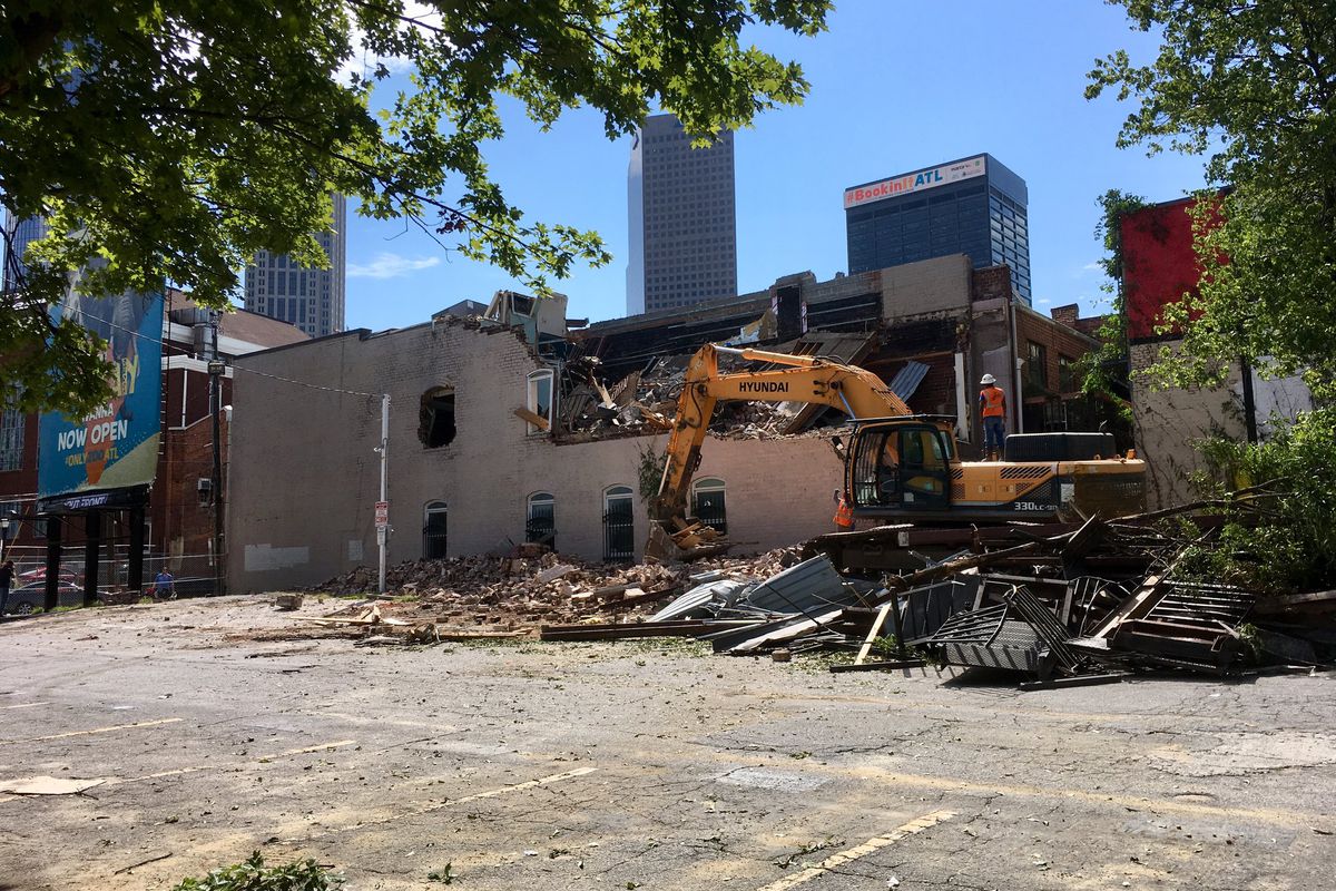 A picture of 152 Nassau Street with a big chunk ripped out of it by a backhoe.