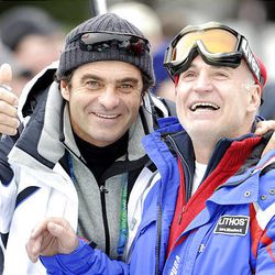 Italian ski legend Alberto Tomba, left, stands in the mixed zone with Giuliano Razzoli ? the father of Italy's Giuliano Razzoli who won the gold medal in the men's slalom ? at the Vancouver 2010 Olympics in Whistler, British Columbia, Saturday.  