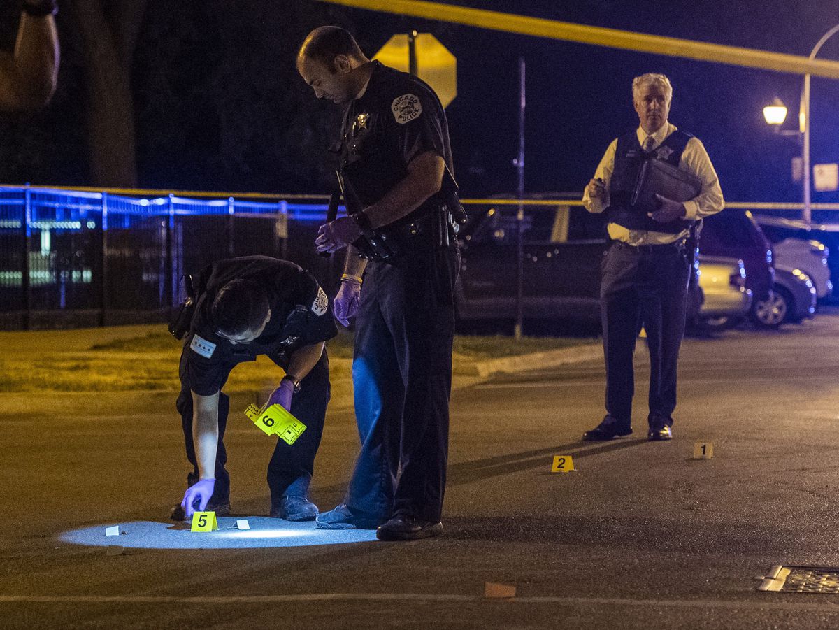 Police investigate a person shot Thursday night in the 5000 block of North Albany. | Tyler LaRiviere/Sun-Times