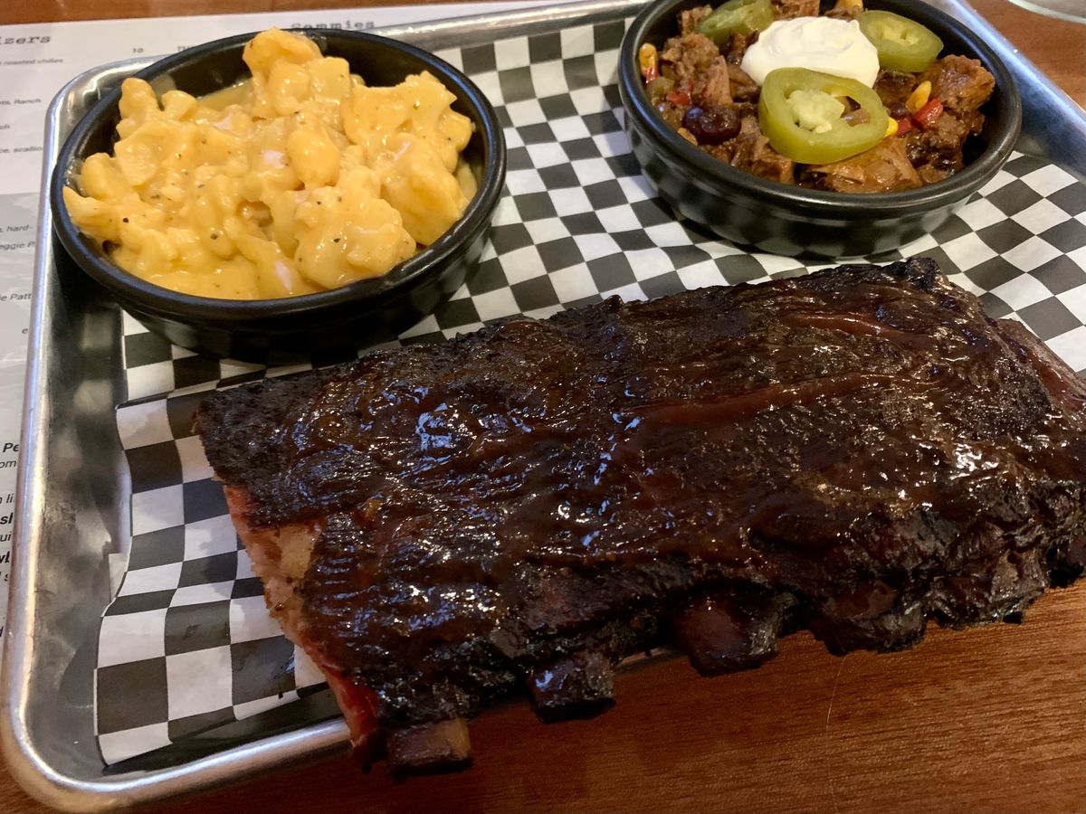 A half rack of ribs on a metal tray