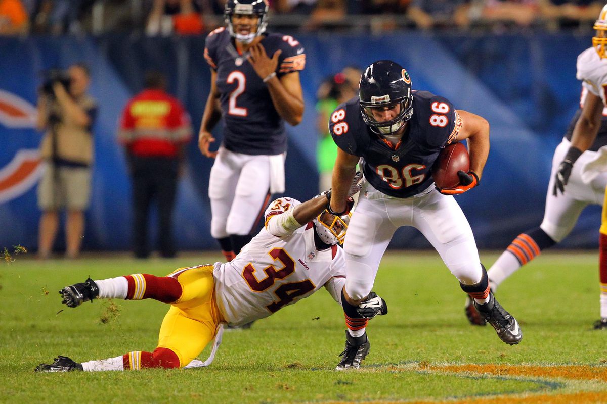 Aug 18, 2012; Chicago, IL, USA; Chicago Bears tight end Kyle Adams (86) escapes the grasp of Washington Redskins defensive back Tanard Jackson (34) during the second quarter at Soldier Field. Mandatory Credit: Dennis Wierzbicki-US PRESSWIRE