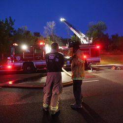 Provo Fire Fighters work on a fire at 2400 University in Provo Thursday, June 13, 2013.