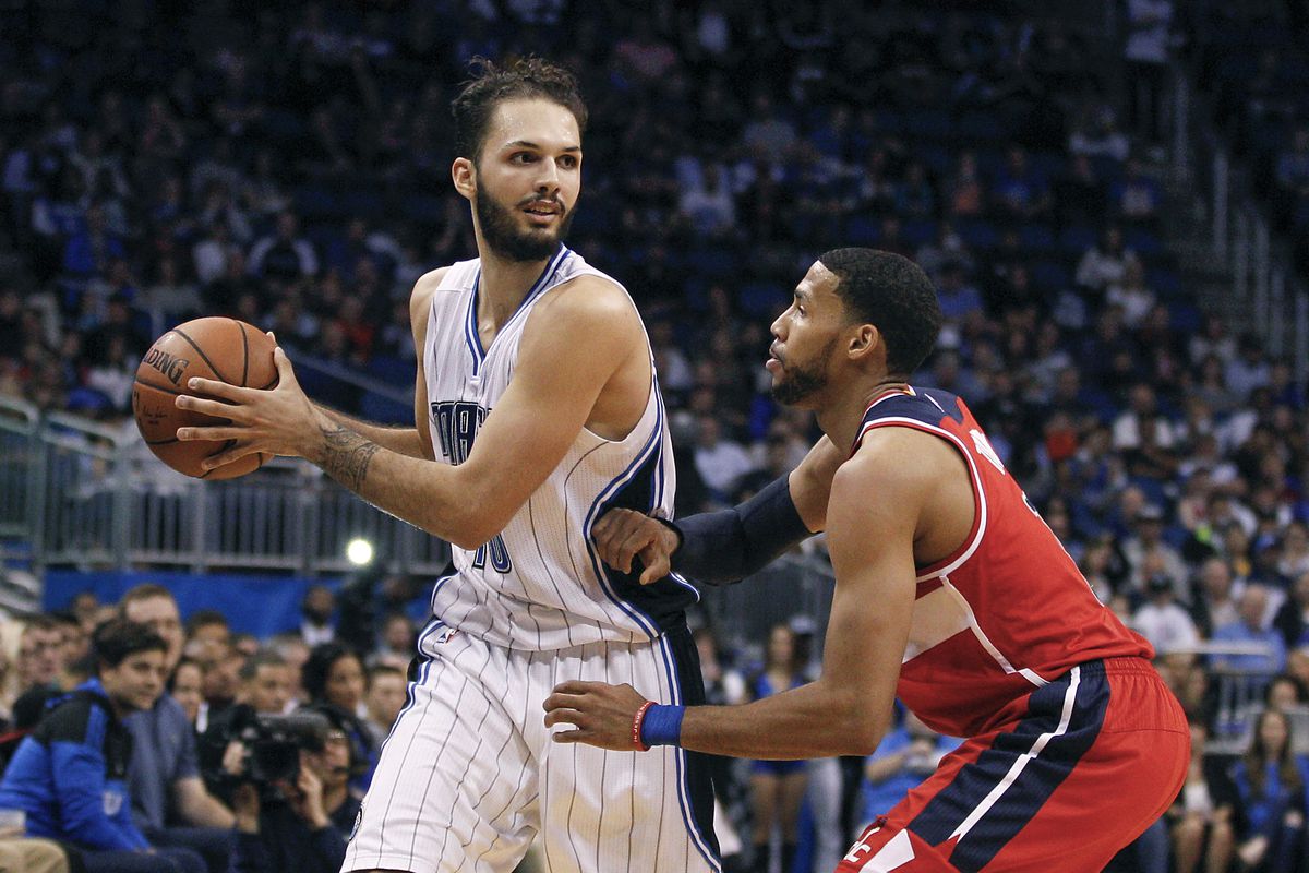 Orlando Magic guard Evan Fournier protects the ball from Washington Wizards guard Garrett Temple during the second quarter at Amway Center.