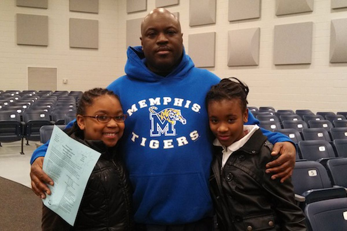 Kenneth Woods and his daughters Breanna Rosser (r) and Taylor Woods (r) reviewed 12 powerful words with sixth grade language arts teacher Patricia Hervey.