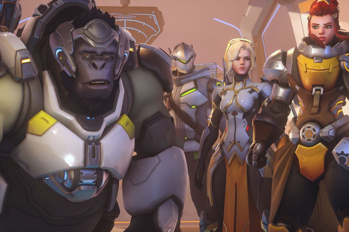Winston, Genji, Mercy, and Brigitte stand side by side in their default costumes in a still from Overwatch 2