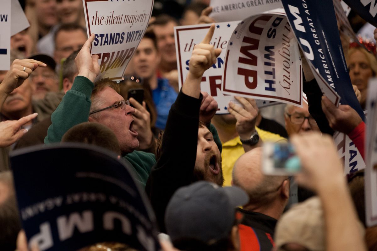 A protester interrupts as Republican presidential candidate Donald Trump speaks at a campaign event at the I-X Center March 12, 2016, in Cleveland, Ohio. 