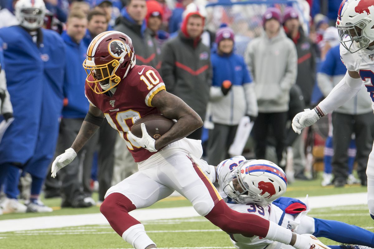 Washington wide receiver Paul Richardson tries to break a tackle by Buffalo Bills defensive back Levi Wallace in the third quarter at New Era Field.