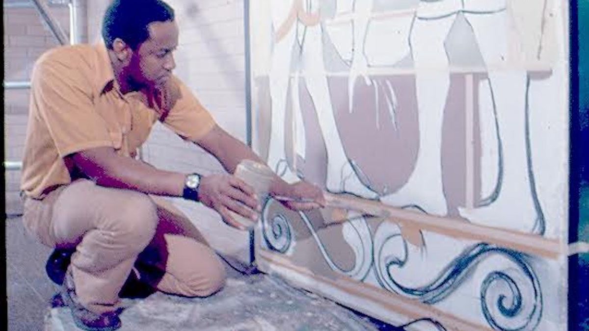 Muralist Eugene “Eda” Wade works on the doors at Malcolm X College to transform them into works of art spotlighting Black culture and Egyptian and West African designs. The early 1970s project took two years to complete.