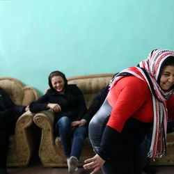In this Monday, Feb. 2, 2015 photo, female drug addicts play pantomime, at Chitgar treatment camp, in a mountain village northwest of Tehran, Iran. Anti-narcotics and medical officials say more than 2.2 million of Iran's 80 million citizens already are addicted to illegal drugs, including 1.3 million on registered treatment programs. They say the numbers keep rising annually, even though use of the death penalty against convicted smugglers has increased, too, and now accounts for more than nine of every 10 executions. 