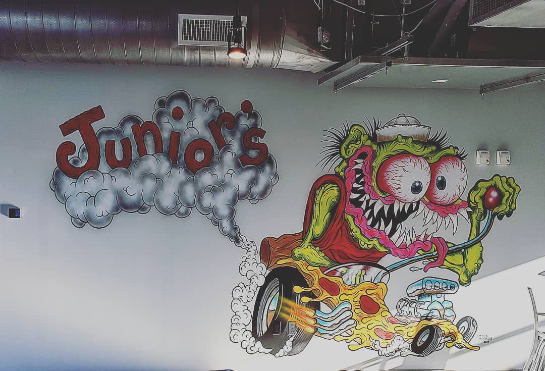 Local artist Moström created the 1960s Ed Roth-style hot-rodding monster mural on the wall of Junior’s Pizza in Summerhill. 