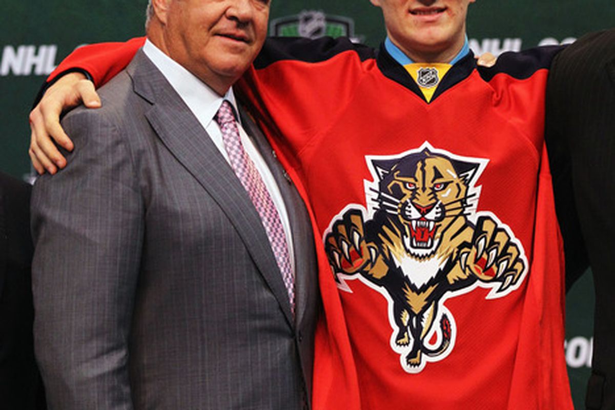 Florida GM Dale Tallon (l), and some stiff he selected last June