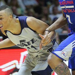 Utah Jazz guard Dante Exum (11) pushes the ball up court with Philadelphia 76ers guard Markelle Fultz (7) defending as the Utah Jazz and the Philadelphia 76ers play in Summer League action in the Huntsman Center at the University of Utah in Salt Lake City on Wednesday, July 5, 2017.