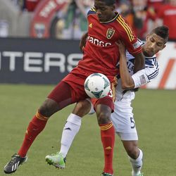 Real Salt Lake forward Olmes Garcia, left, and Los Angeles Galaxy defender Sean Franklin (5) battle for a ball during the first half of an MLS soccer game Saturday, April 27, 2013, Sandy, Utah.  