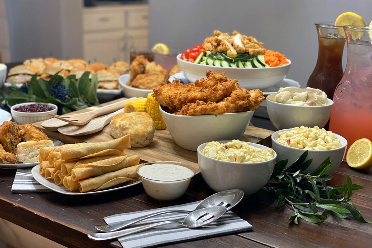 A table filled with clucker sandwiches, gobbler specials and clucketo chicken tacos, from the famous Farm Basket menu.