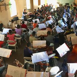 Utah Symphony conductor Thierry Fischer rehearsing with the Haitian National Orchestral Institute.