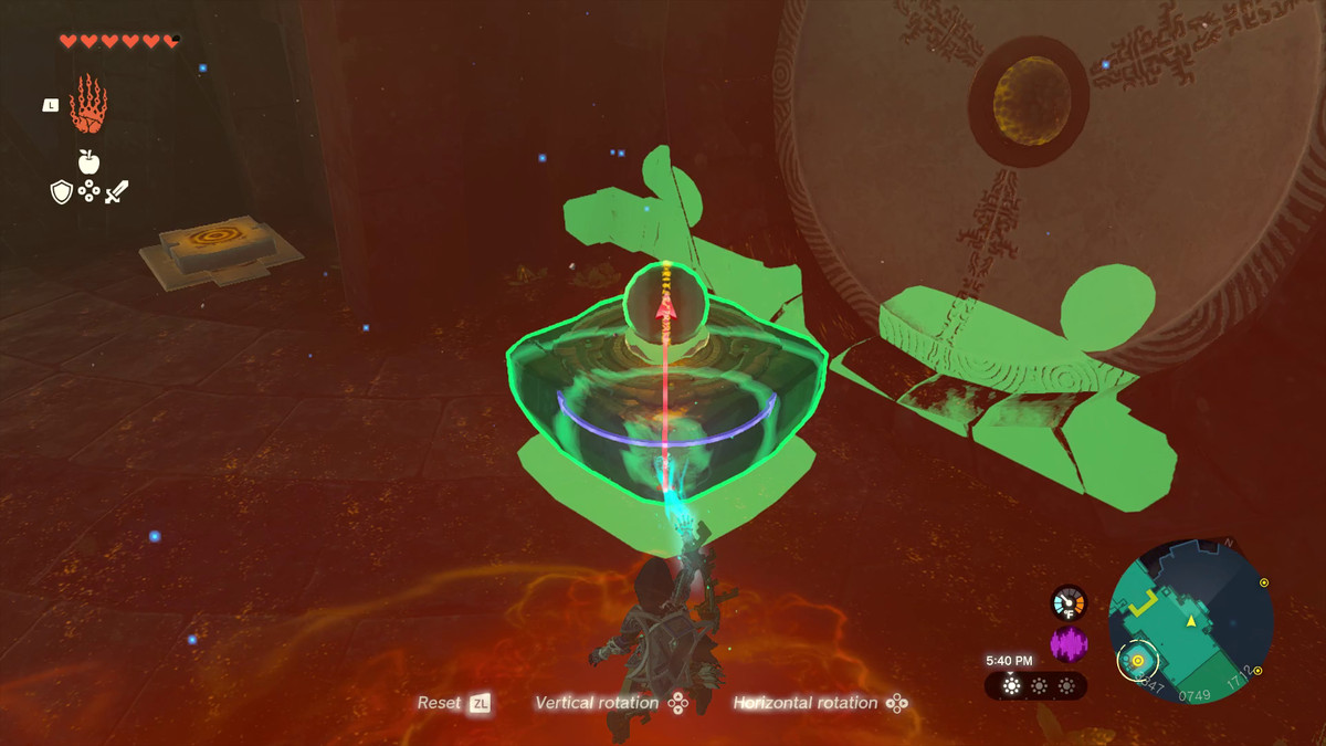 Link uses Ultrahand to surround a small floating platform in a glowing, green aura. A hemisphere line bisecting the platform indicates how the player can rotate it to manipulate the platform and the ball sitting on top.