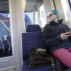 Rob Weidmann rides TRAX on his morning commute to work, in which he uses bus, TRAX and FrontRunner to get from Salt Lake City to Lehi, on Thursday, Nov. 8, 2018.