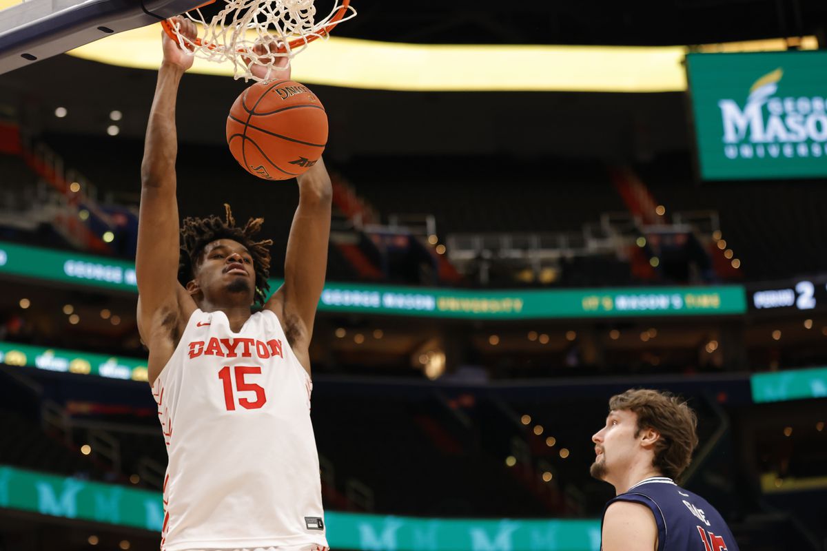 Dayton Flyers forward DaRon Holmes II (15) dunks the ball as Richmond Spiders forward Matt Grace (15) looks on in the second half at Capital One Arena.
