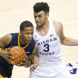 Coppin State guard Josh Treadwell (3) drives the lane against Brigham Young guard Elijah Bryant (3) during an NCAA college basketball game in Provo on Thursday, Nov. 17, 2016.