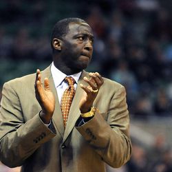 Utah Jazz head coach Tyrone Corbin applauds a play during a game at EnergySolutions Arena on Monday, Dec. 2, 2013.