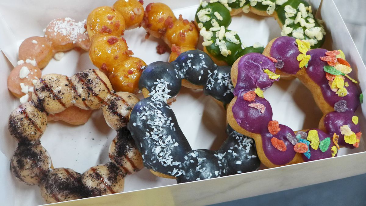 Since doughnuts made of conjoined balls in a box in a variety of garish colors.