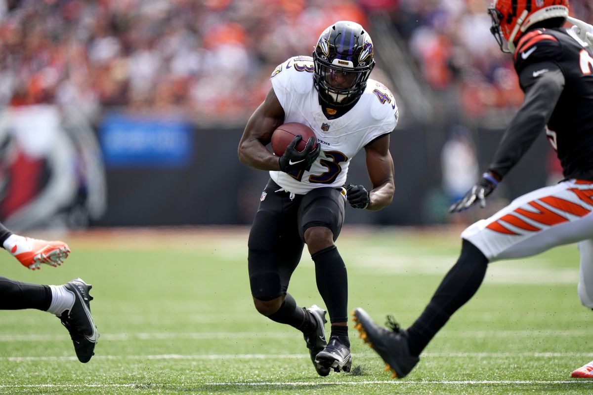 Baltimore Ravens running back Justice Hill (43) carries the ball in the first quarter of a Week 2 NFL football game between the Baltimore Ravens and the Cincinnati Bengals
