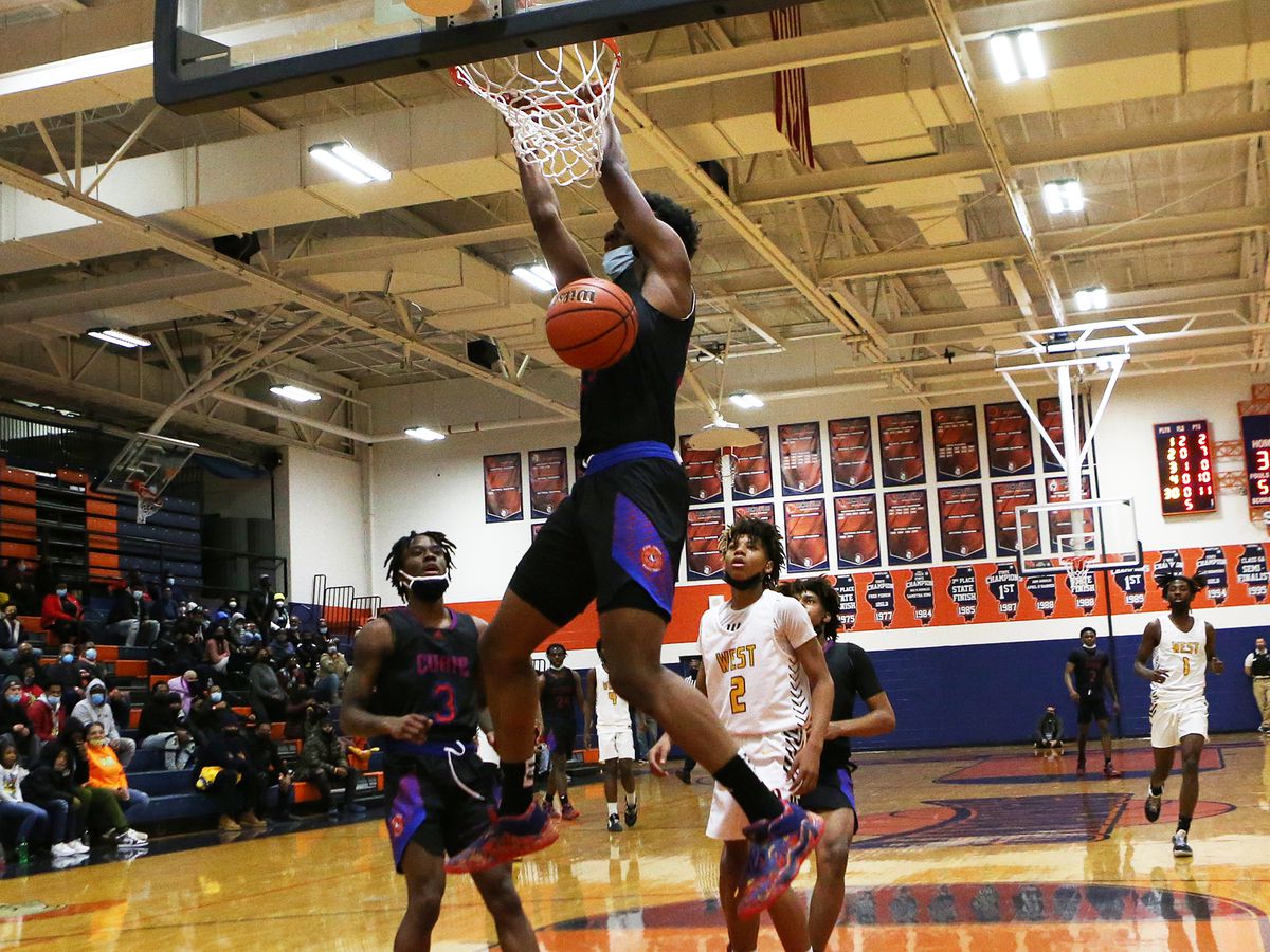 Curie’s Chikasi Ofomo (23) dunks in the fourth quarter against Joliet West.